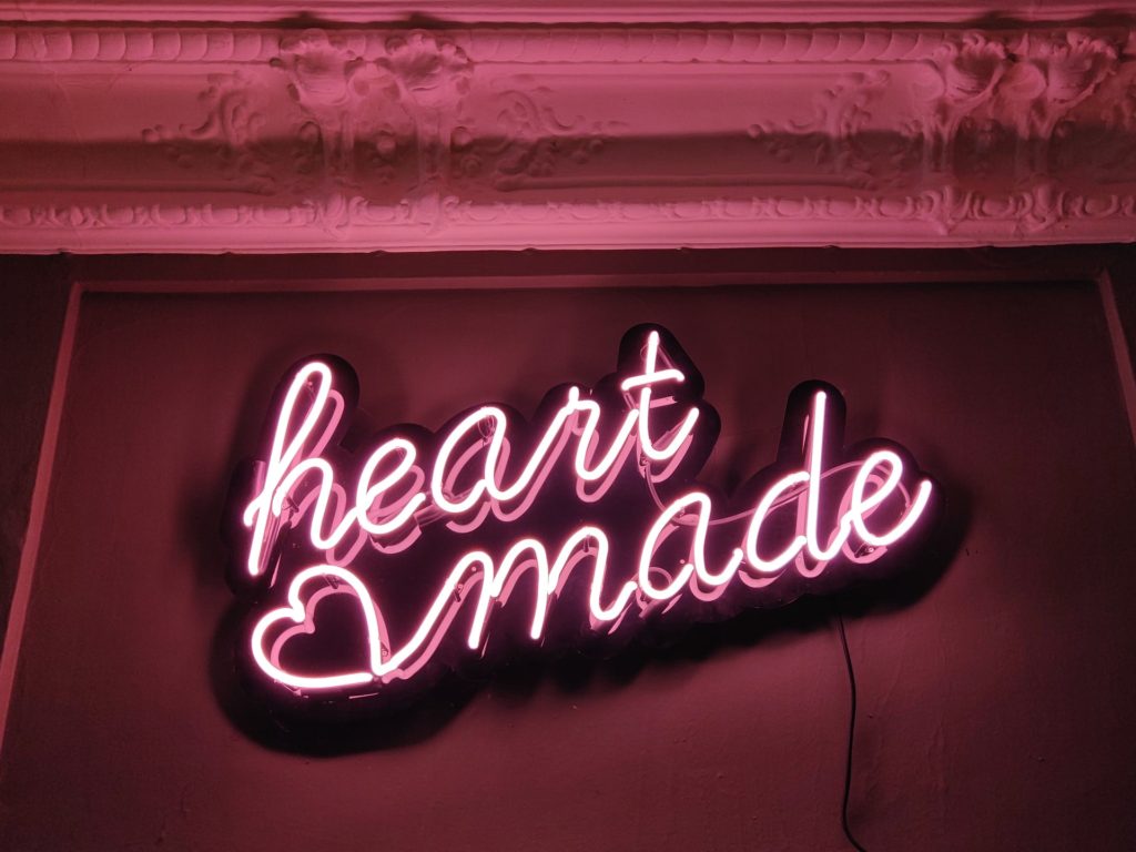 Neon sign that reads "heart made" - because you need relationship and emotional connections to create better case studies and testimonials that are impactful