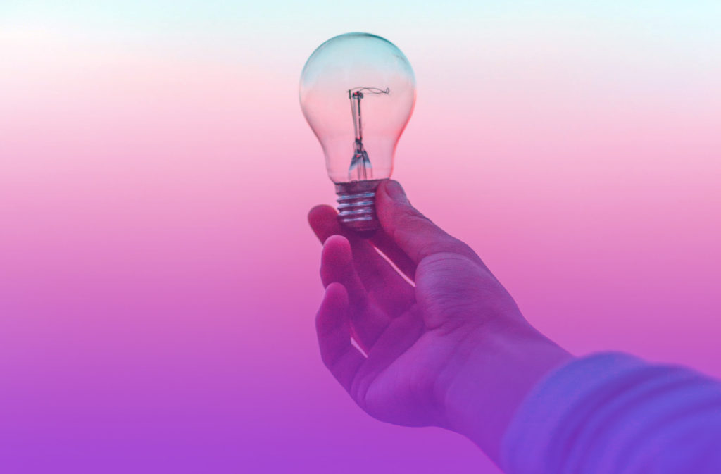 Lightbulb being held by a hand to represent the smart ideas presented in this case study on how COVID-19 inspired a pre launch marketing campaign