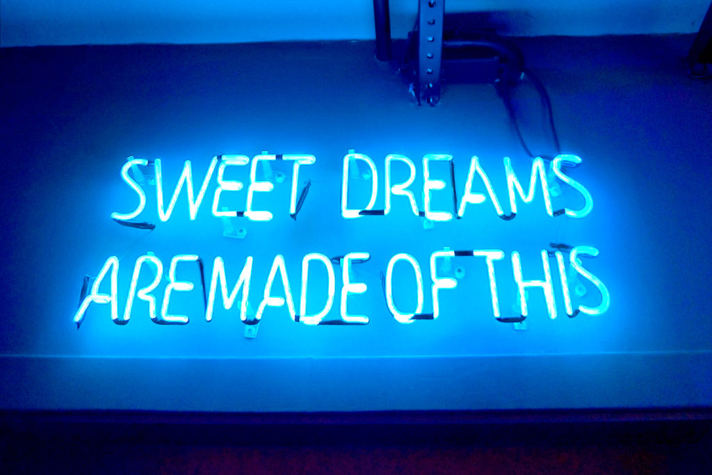 neon sign saying sweet dreams are made of this. this article is about the marketer's sweet dream of how to improve SEO rankings and land at #1