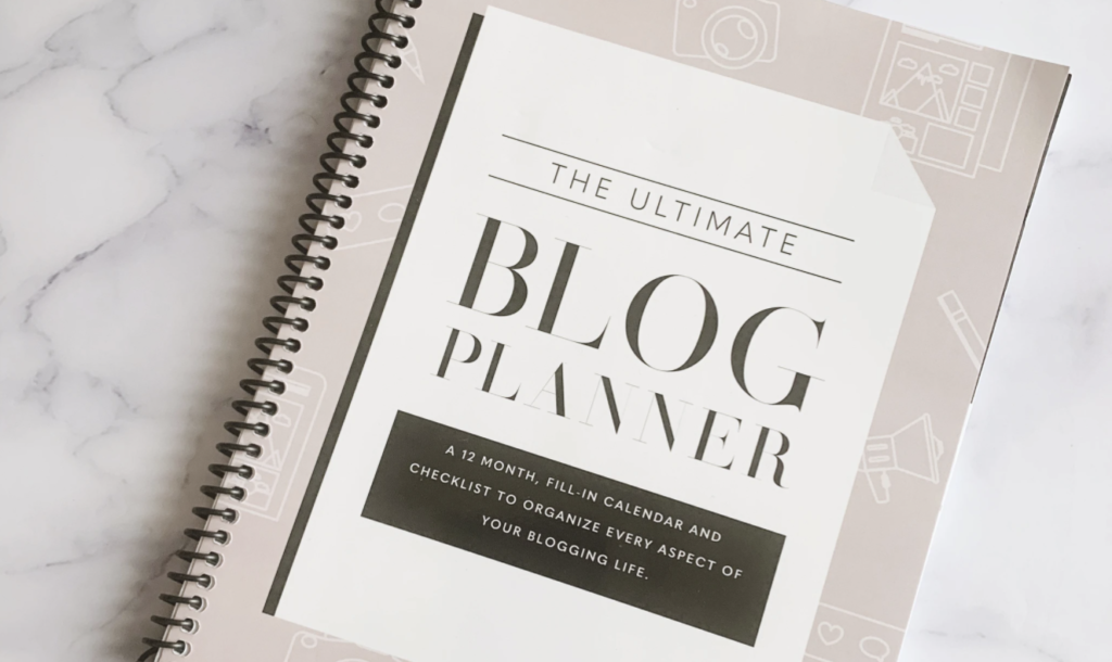 spiral notebook that says the ultimate blog planner on it - great gift for content creators, bloggers, marketers and copywriters