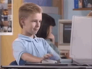 gif of adolescent nodding his head at a computer screen and then giving the camera a thumbs up, with a vintage 1990s feel