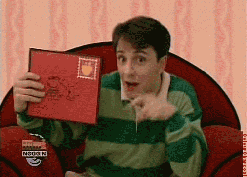 steve, the original host of nickelodeon kid's show blue's clues, holding a red envelope he received in the mail. holiday marketing psychology, as demonstrated in the 1974 Season's Greetings experiment, says people are more willing to support businesses or brands that they feel has provided them some sort of value as part of the concept of reciprocity