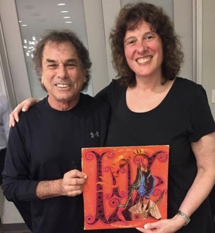 Kim Kaiman backstage with Mickey Hart of the Grateful Dead holding up one of his records
