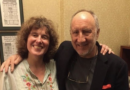 Kim Kaiman posing and smiling with Pete Townshend, co-founder of The Who.