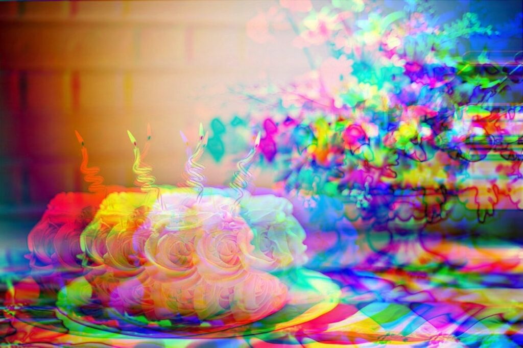 distorted, pixelated image of a cake with candles and flowers in a vase resting on a table as cover art for the article on how to improve b2b advertising strategy for more conversions, lead generation and ROI