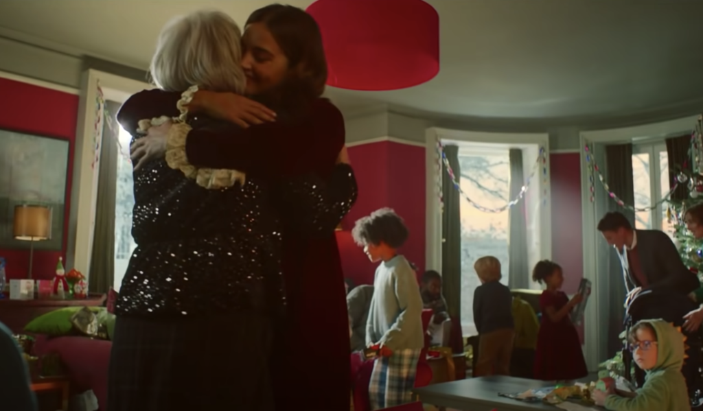 Actress Jenna Coleman hugging a woman playing her Nan in the Boots UK 2021 Christmas advert, one of the favorite holiday marketing campaigns released in November 2021